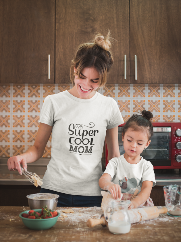 happy woman cooking with her daughter wearing t shirts mockup a20291
