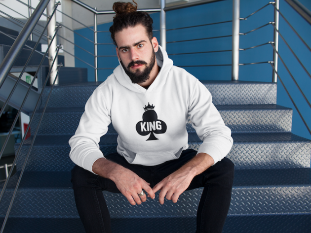 hipster man with beard wearing a pullover hoodie mockup sitting on metal stairs a17763