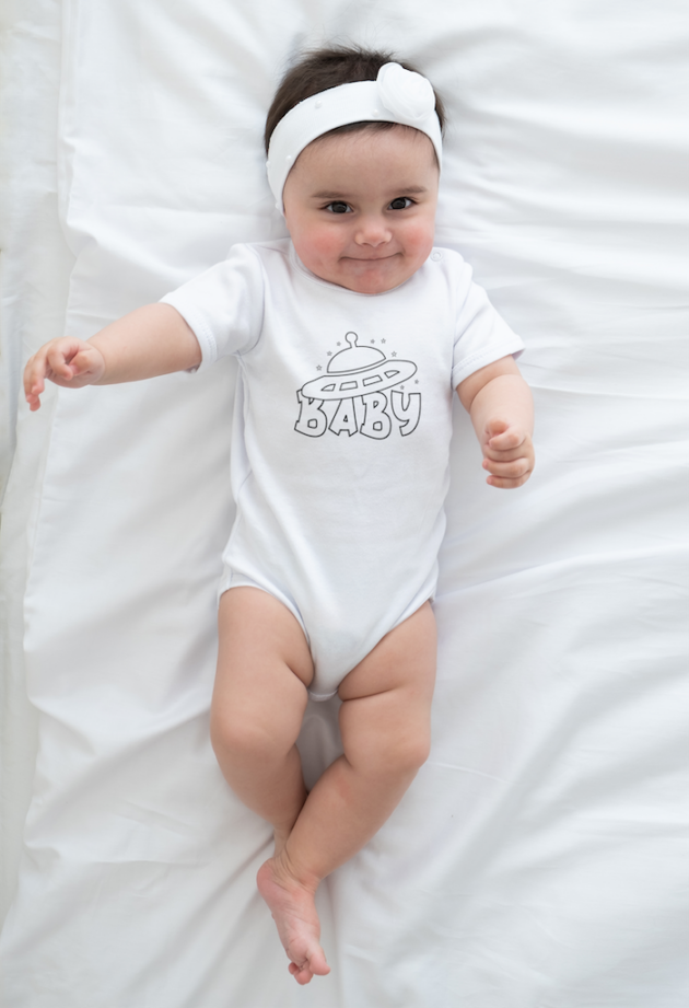 mockup featuring a cute baby girl wearing an all over onesie m6224 r el2 2