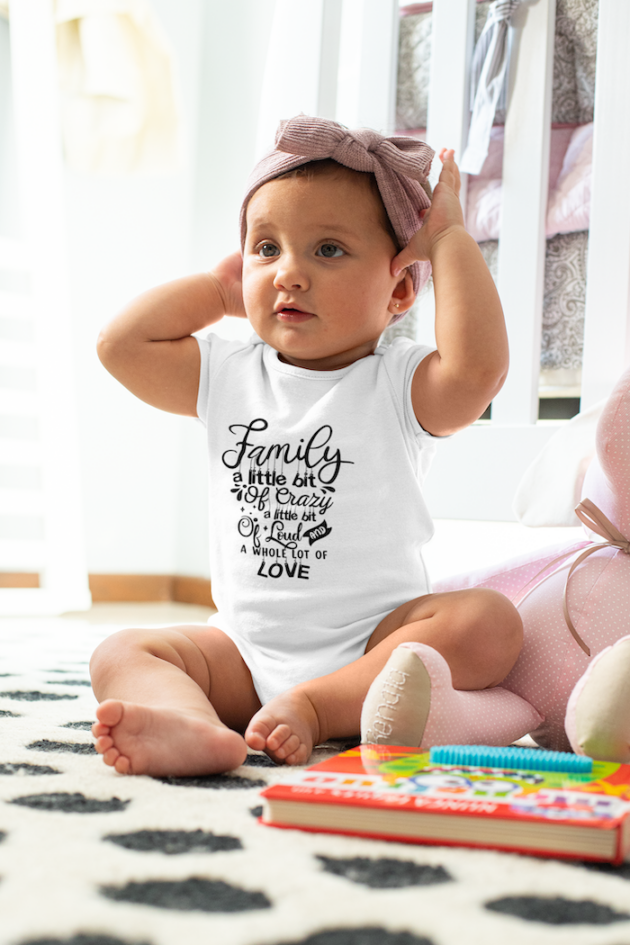 mockup of a baby girl wearing an onesie and a big bow m922 1