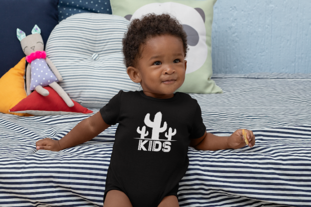 mockup of a baby wearing a sublimated onesie 30023