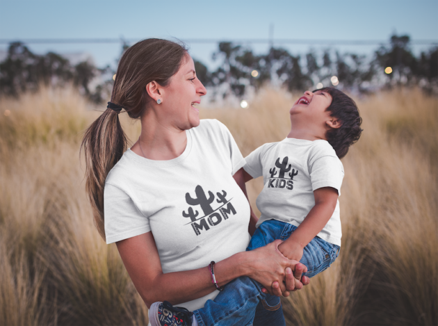 mom and son wearing t shirts mockup outdoors while having fun a20203