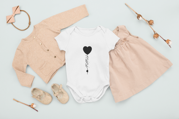 onesie mockup featuring a girl s outfit in a flat lay style m1138 1