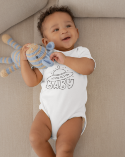 onesie mockup featuring a joyful baby boy grabbing his stuffed toy 25123