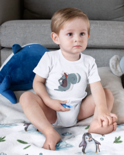 onesie mockup of a boy sitting on a sublimated blanket 30015 2