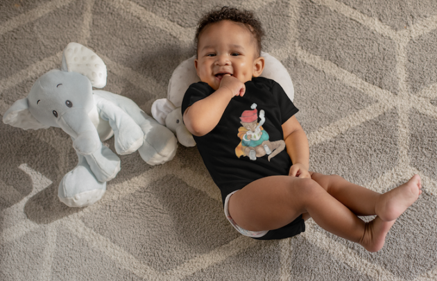 onesie mockup of a sweet baby boy with dimples next to his stuffed toys 25115 2