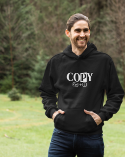 pullover hoodie mockup of a smiling man in an open green area 25103