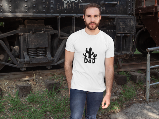 shirt mockup of a man posing in front of a train wagon 28190 1