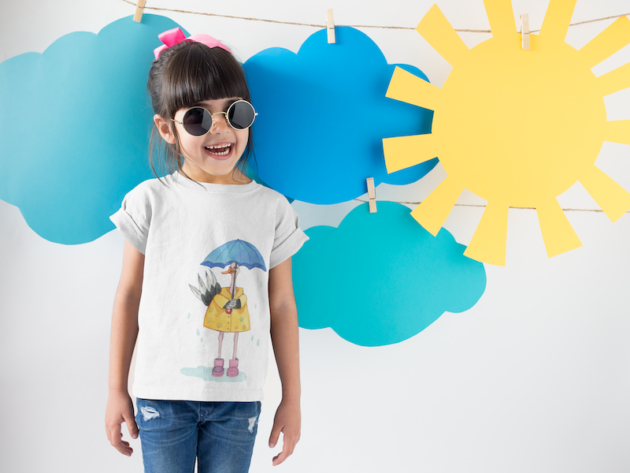 smiling girl wearing a round neck tshirt template near cardboard sun and clouds a19480 1 1