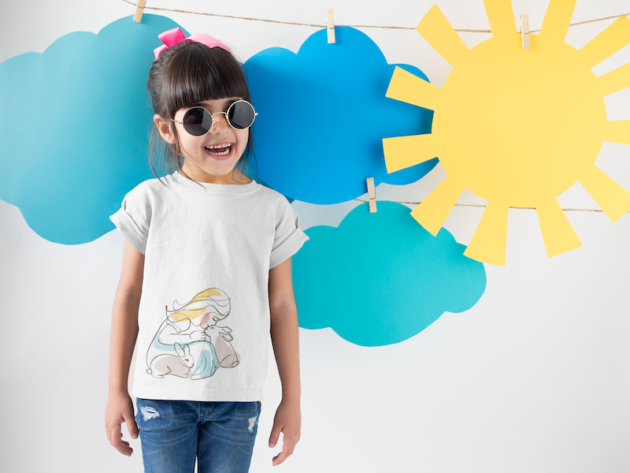 smiling girl wearing a round neck tshirt template near cardboard sun and clouds a19480 3