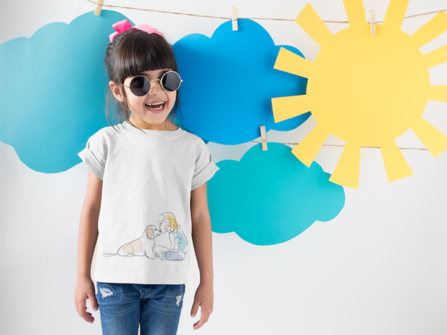 smiling girl wearing a round neck tshirt template near cardboard sun and clouds a19480 9