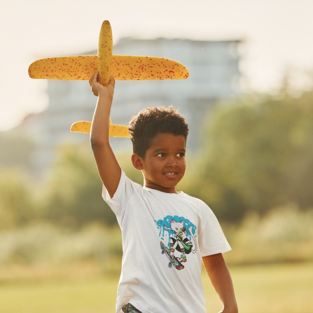 t shirt mockup of a little boy playing a toy plane m16741 r el2