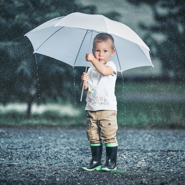 t shirt mockup of a little boy standing in the rain 42911 r el2 1