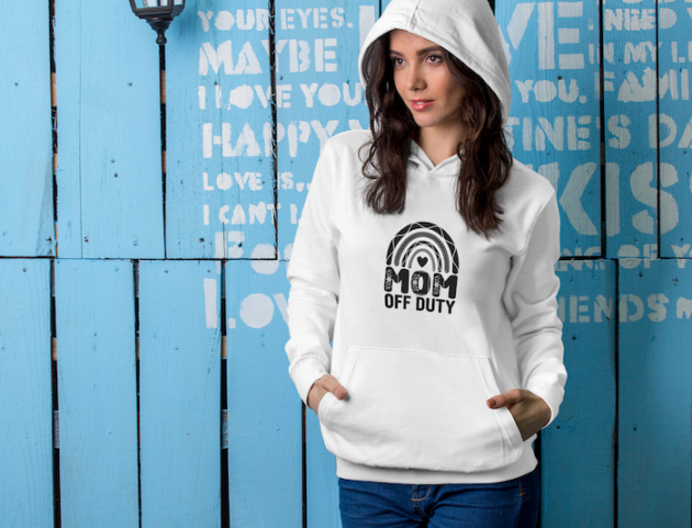 hoodie mockup of a brunette woman posing against a blue wooden wall 5310 el1