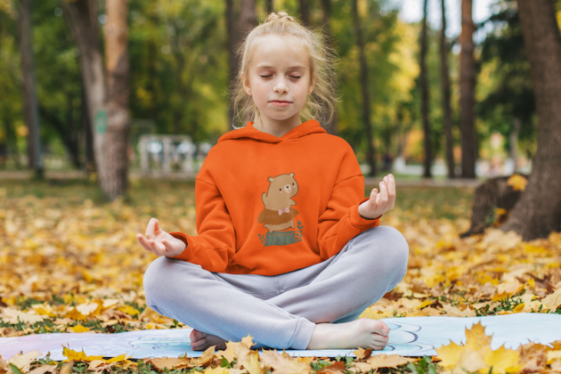 hoodie mockup of a little girl meditating at a park m18018 r el2 2