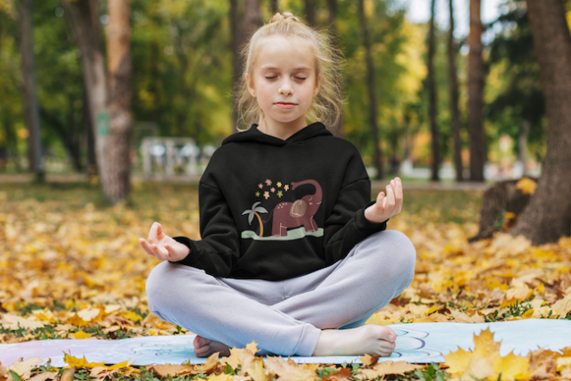 hoodie mockup of a little girl meditating at a park m18018 r el2 3