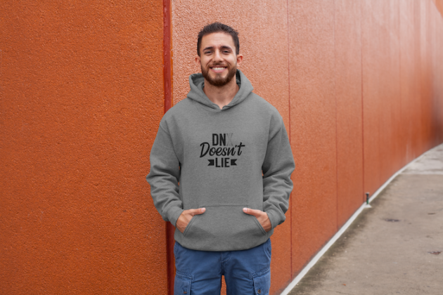 hoodie mockup of a man posing against a red wall 28630