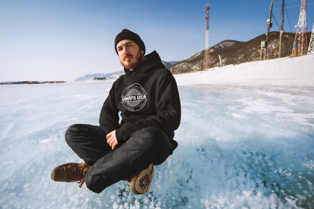 hoodie mockup of a man sitting on a frozen lake m20933 r el2