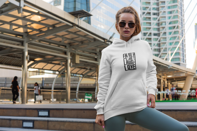 hoodie mockup of a woman posing in front of a city landscape 3556 el1