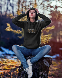 hoodie mockup of a woman sitting on a tree stump 2780 el1