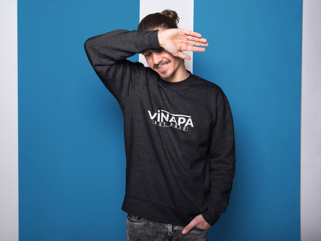 long haired dude with beard wearing a crewneck sweatshirt mockup while blocking his face a18530