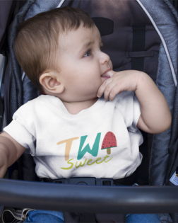 mockup of a baby boy wearing a round neck tshirt template while on his stroller a16089 1