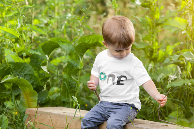 mockup of a boy wearing a t shirt in nature 2917 el1 1