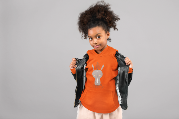 mockup of a little girl with a curly ponytail showing off her pullover hoodie 24863 1