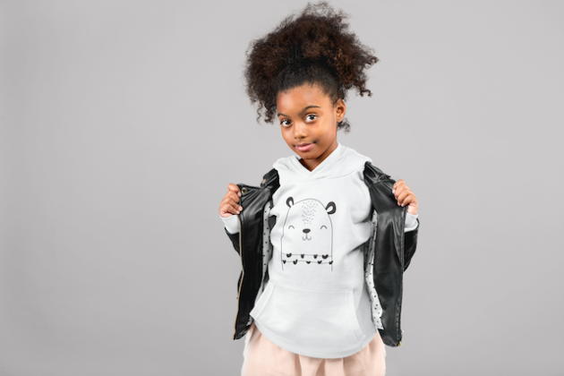 mockup of a little girl with a curly ponytail showing off her pullover hoodie 24863 2