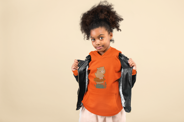 mockup of a little girl with a curly ponytail showing off her pullover hoodie 24863