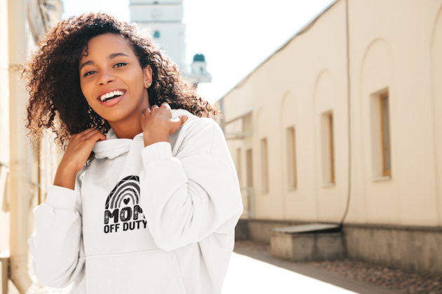pullover hoodie mockup of a smiling woman with curly hair on a street m25557 r el2