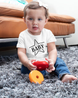 sublimated t shirt mockup of a baby girl playing with toys m937 1