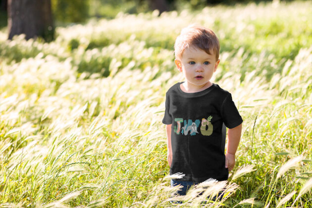 t shirt mockup of a little boy surrounded by tall grass 2912 el1 2